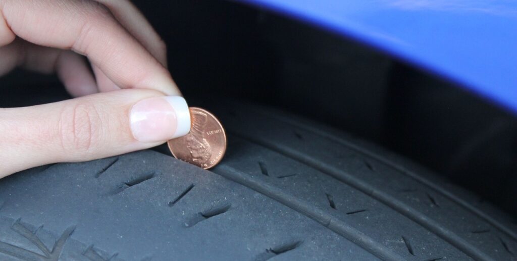 how to check tire tread with a penny